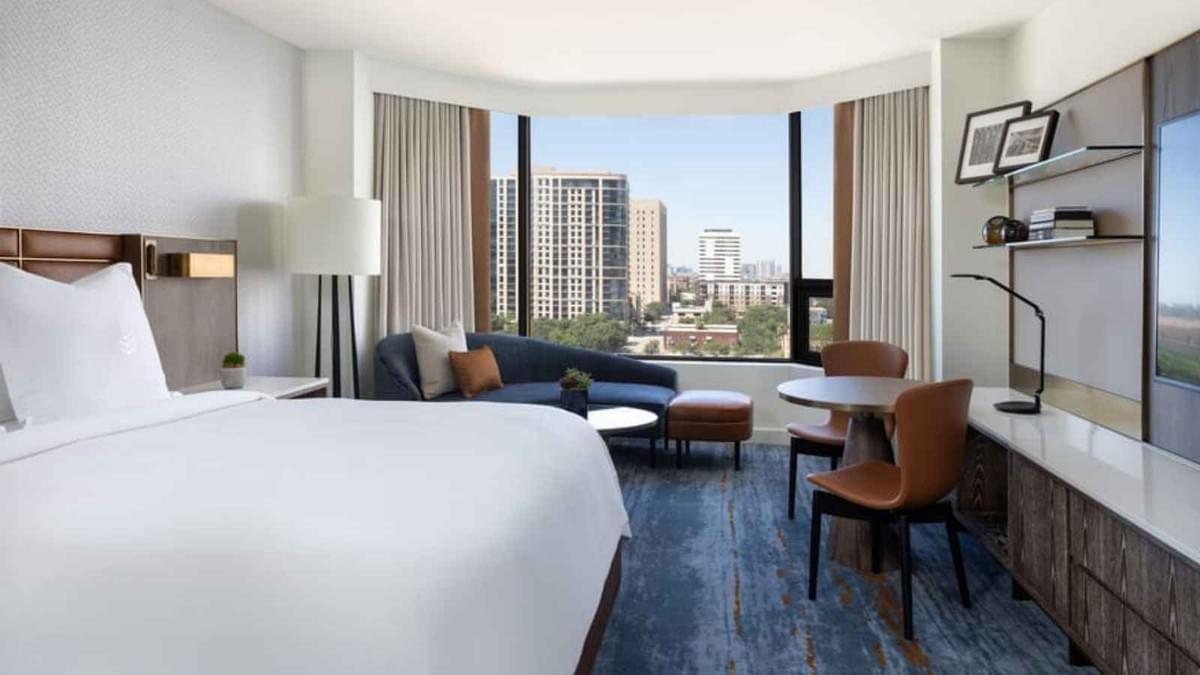 Moontree crafted this modern 5-star Four Seasons hotel suite in Downtown Houston, featuring skyline views and upscale contemporary hospitality interiors.