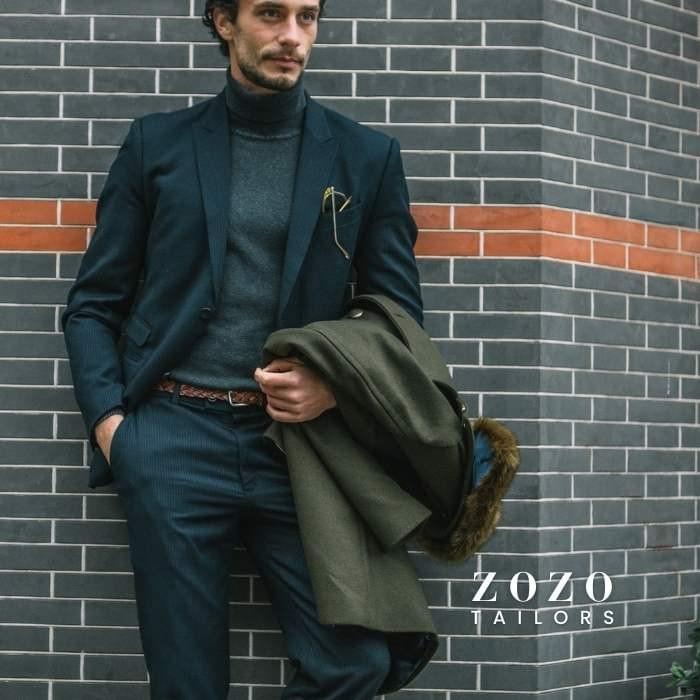 Indigo blue suit with a charcoal merino polo neck — stylish option for cool seasons, combining comfort with elegance.
