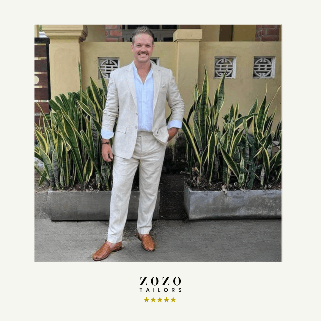 Person wearing a light linen suit for warm-weather tailoring