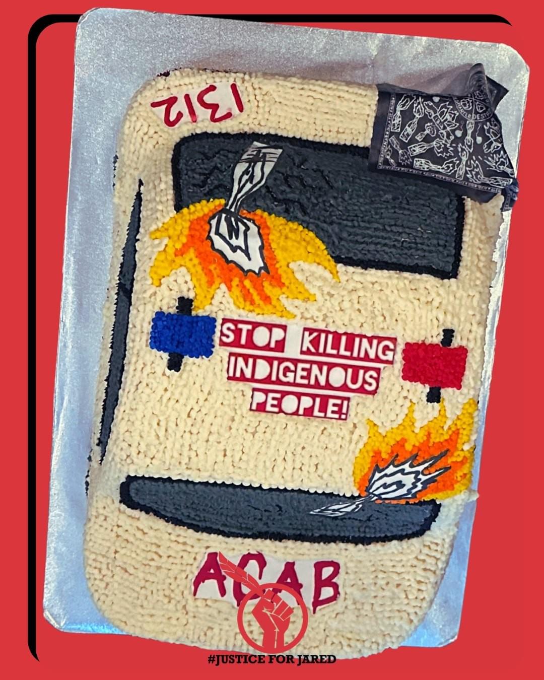  Close-up of a cake, covered in white icing to mimic beadwork. The cake features 2 molot*v c*cktails, a banda, and the text "1312," "STOP KILLING INDIGENOUS PEOPLE," & "ACAB." The background of the image is bright red. At the bottom of the image is the #JusticeForJared logo, a red fist holding an Eagle feather.