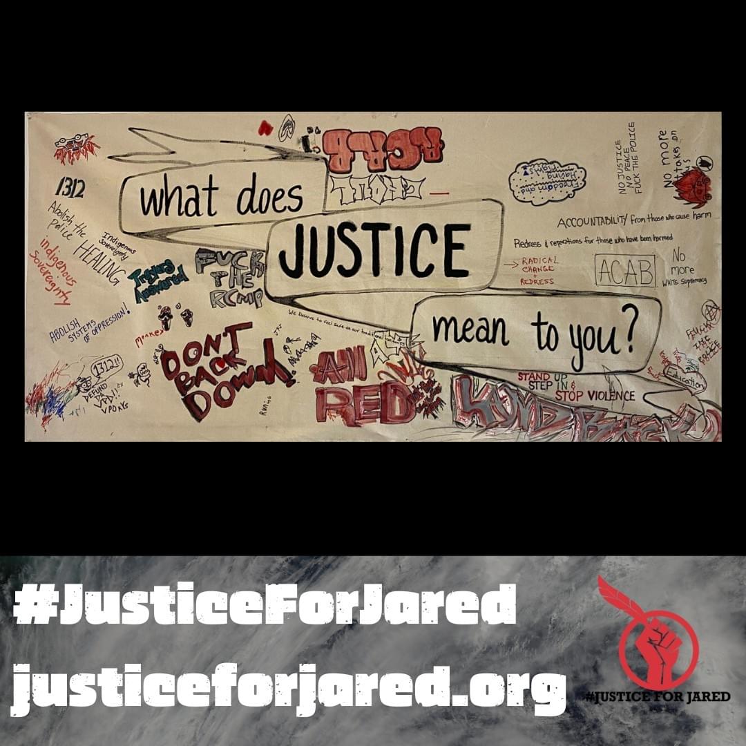 Full view of the collaborative banner on undyed canvas. Centre text: "What does JUSTICE mean to you?" Text is surrounded by handwritten answers in various colours, including silver, red & black. At the bottom of the image a watermark reads: "#JusticeForJared."