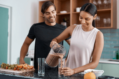 Couple preparing healthy meal together, highlighting balanced diet and wellness routine for weight management