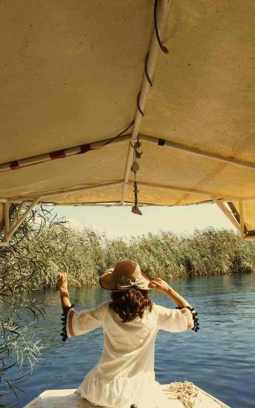 Woman on a safari tour boat Woman on a safari tour boat