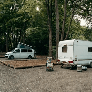 Campervan and Caravan on their pitches