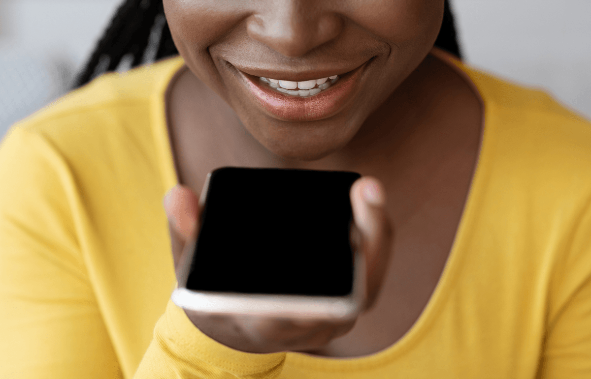 A woman using voice search on her smartphone.