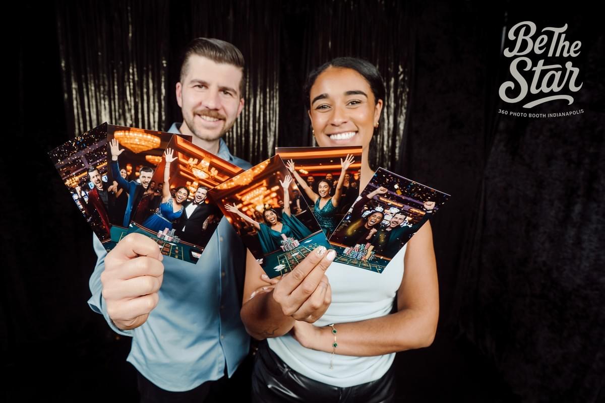 Couple showing pictures of our casino photo booth 