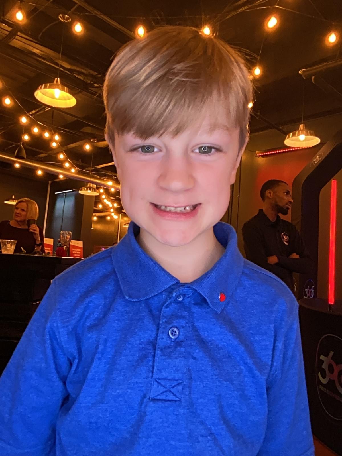 Young man at the Bidwell during a non-profit event using the Roamer booth in Indianapolis at the Bidwell
