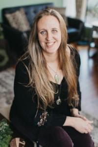 Dr. Jennifer Moody, DAOM, LAc is an expert in holistic health, guiding a client through personalized vitamin and supplement recommendations to enhance overall wellness.