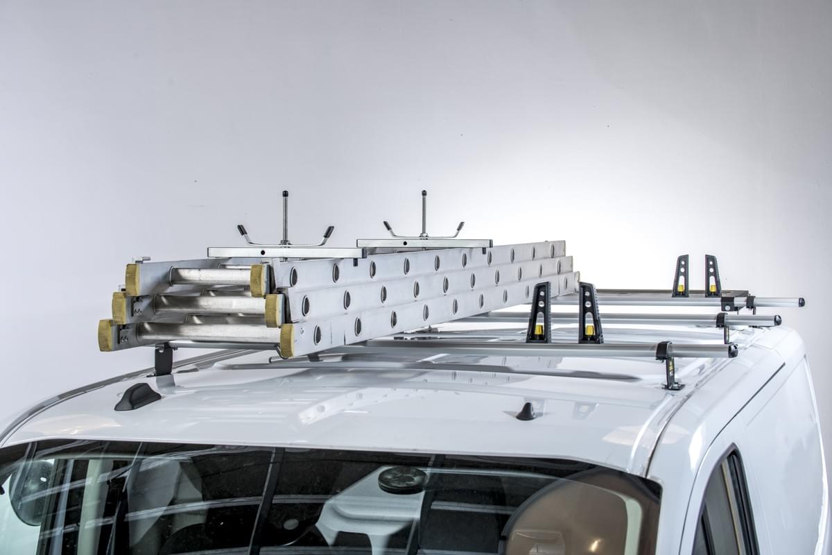 "Anodised aluminium ULTI roof bars mounted on a van, offering corrosion resistance and durability."