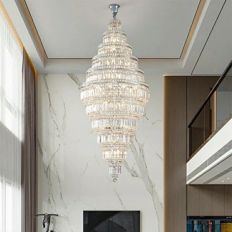 Luxury double-height staircase chandelier with cascading crystals, perfect for open foyer spaces and grand entrances.