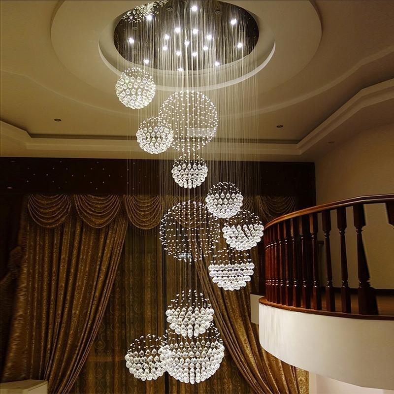 Modern spiral crystal chandelier ideal for stylish staircase foyers.