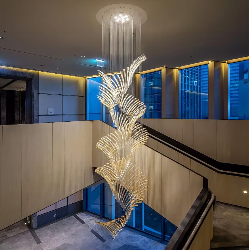 Spiral glass rod chandelier perfect for double-height staircases in luxury homes.