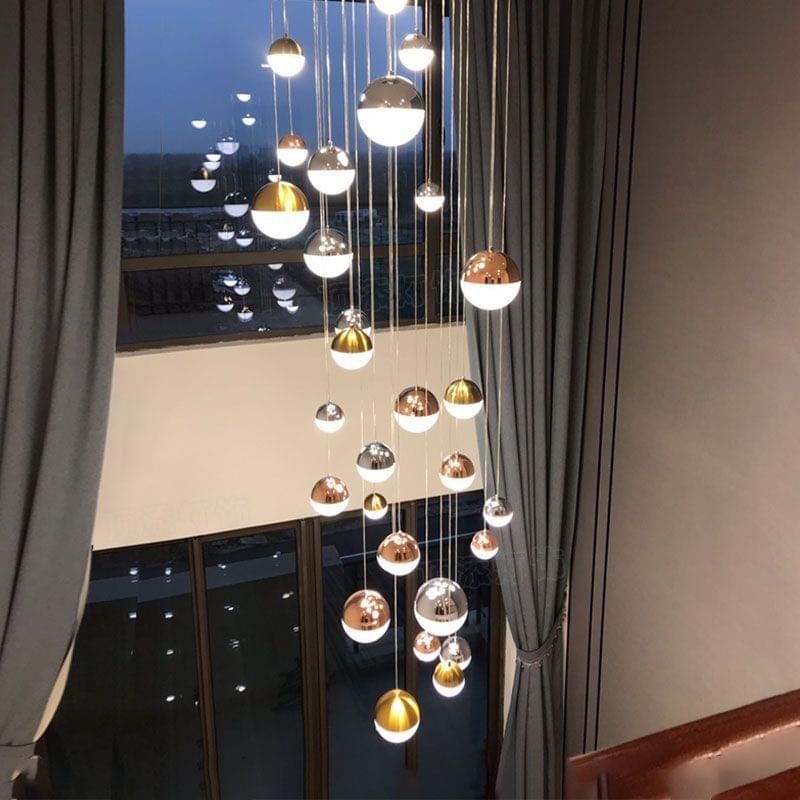 Modern globe chandelier for stairwell with contemporary minimalist design.