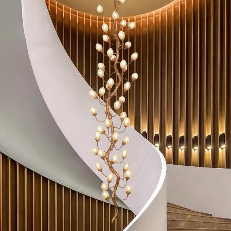 Postmodern brass crystal chandelier for luxurious staircase decor.