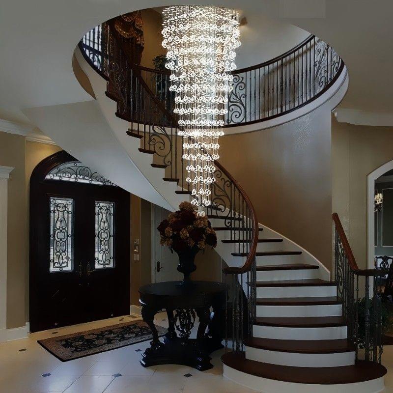 Modern crystal pendant chandelier hanging in staircase entry, ideal for high ceilings and contemporary interiors.