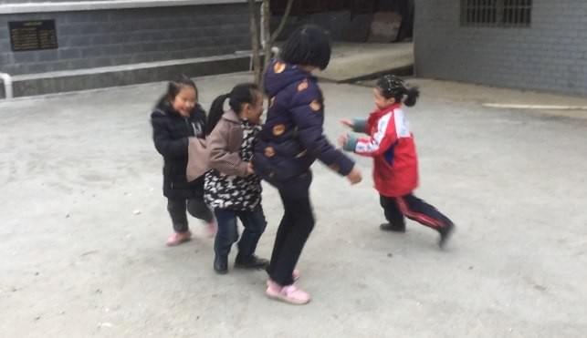 Girls Playing: Mother Hen protects her chics from the fox in red