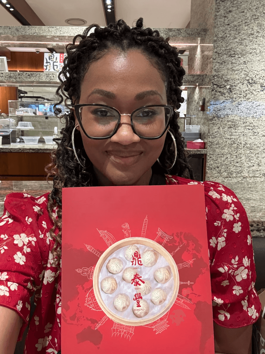 Cultures Uncovered Brit Thompson in DIN TAI FUNG with menu in Taipei, Taiwan