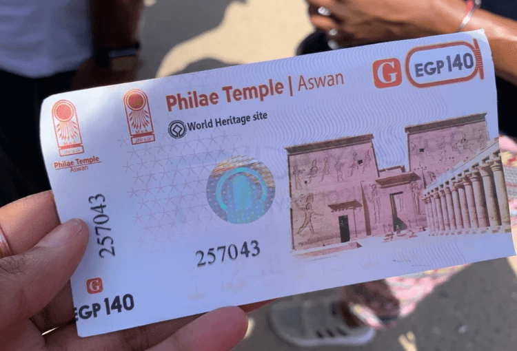 CulturesUncovered Brit Thompson Philae Temple ticket Egypt fruit sailing the felucca on nile river sunset hieroglyphics hot air balloons and umbrellas in Luxor desert