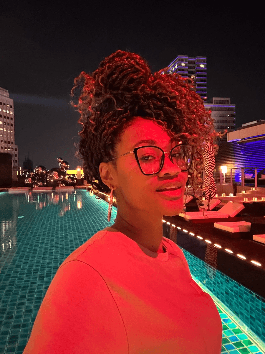 Brit Thompson in at the W Hotel Pool at night in neon lights