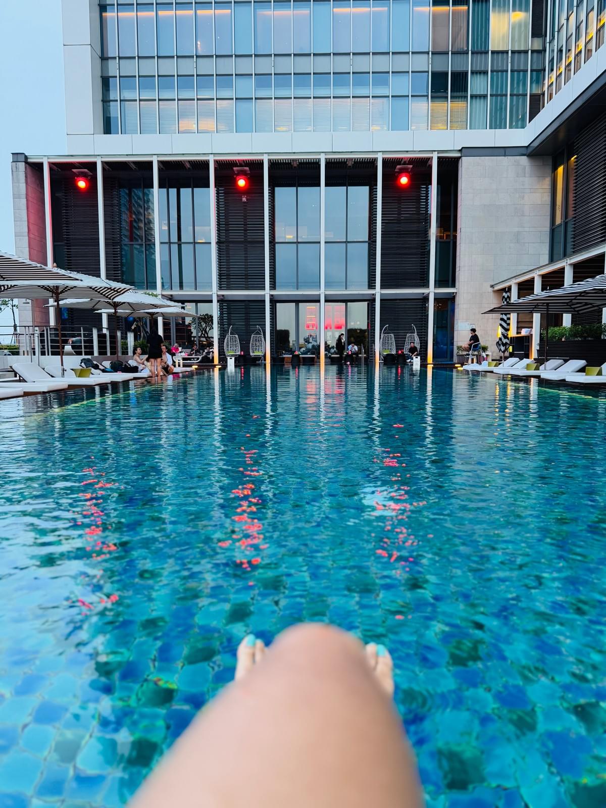 Brit Thompson legs at the ledge of the pool at the W Hotel Taipei in Taiwan