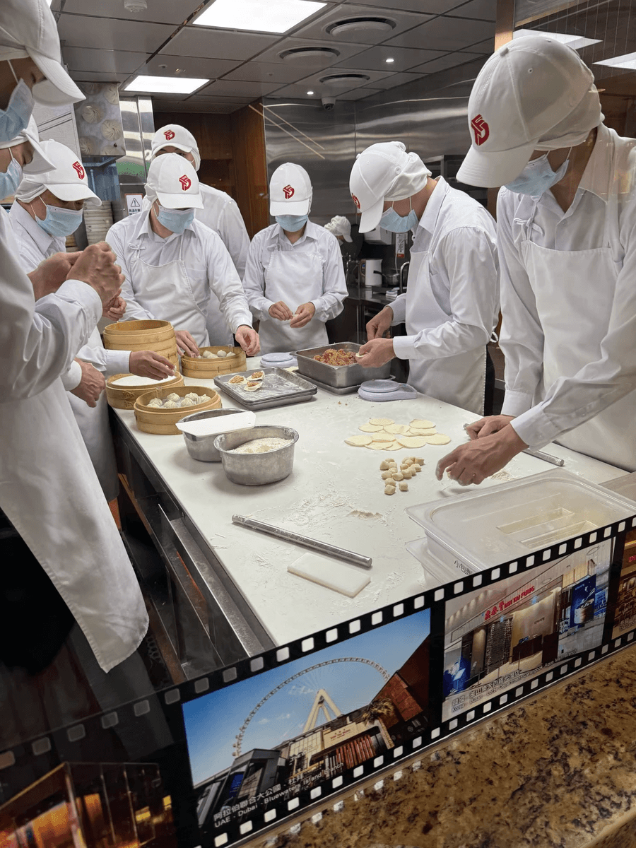 Men hand crafting the soup dumplings in Taipei Taiwan
