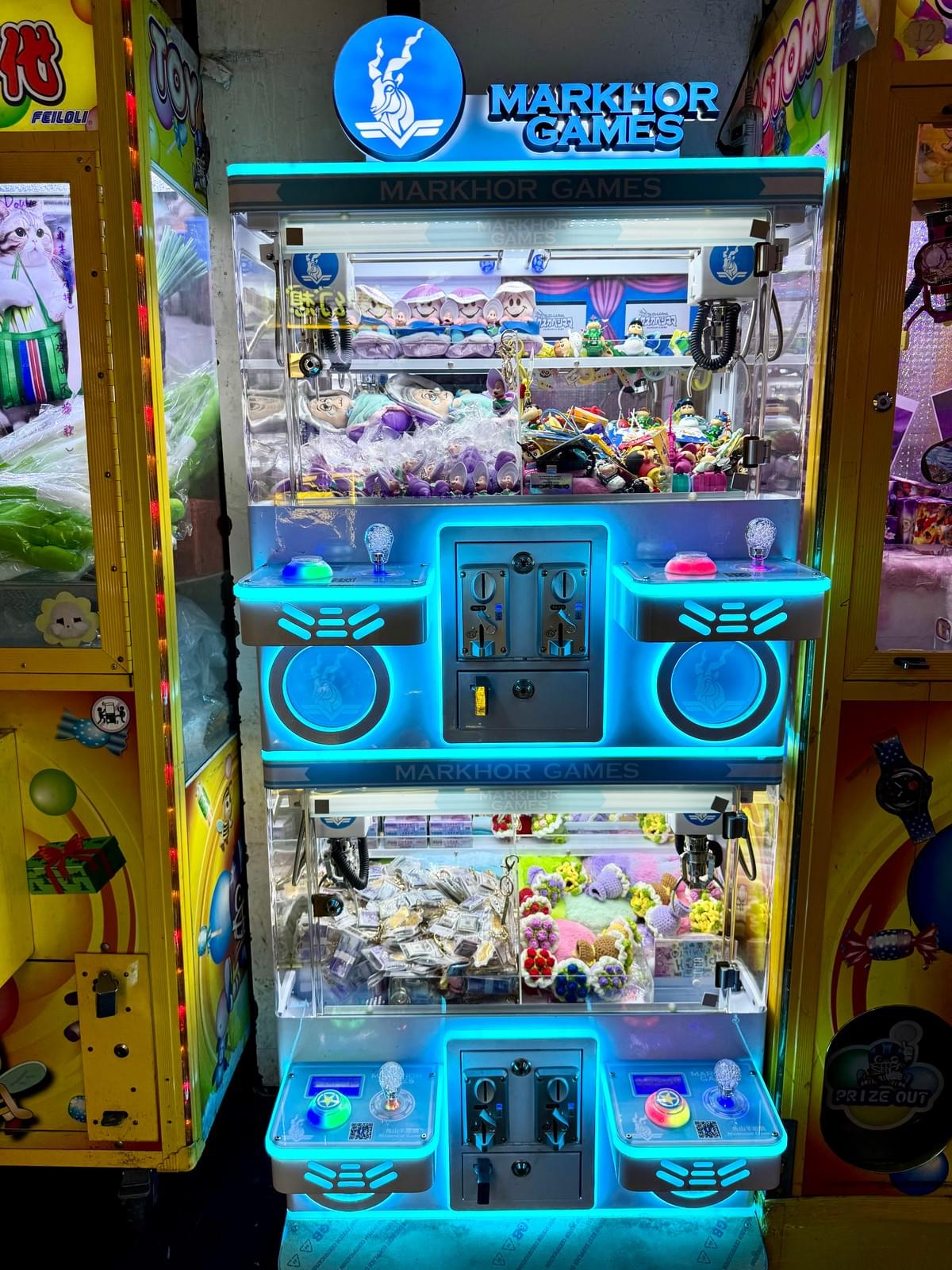 Blue Neon Claw Machine in a Taipei Taiwan night market game room