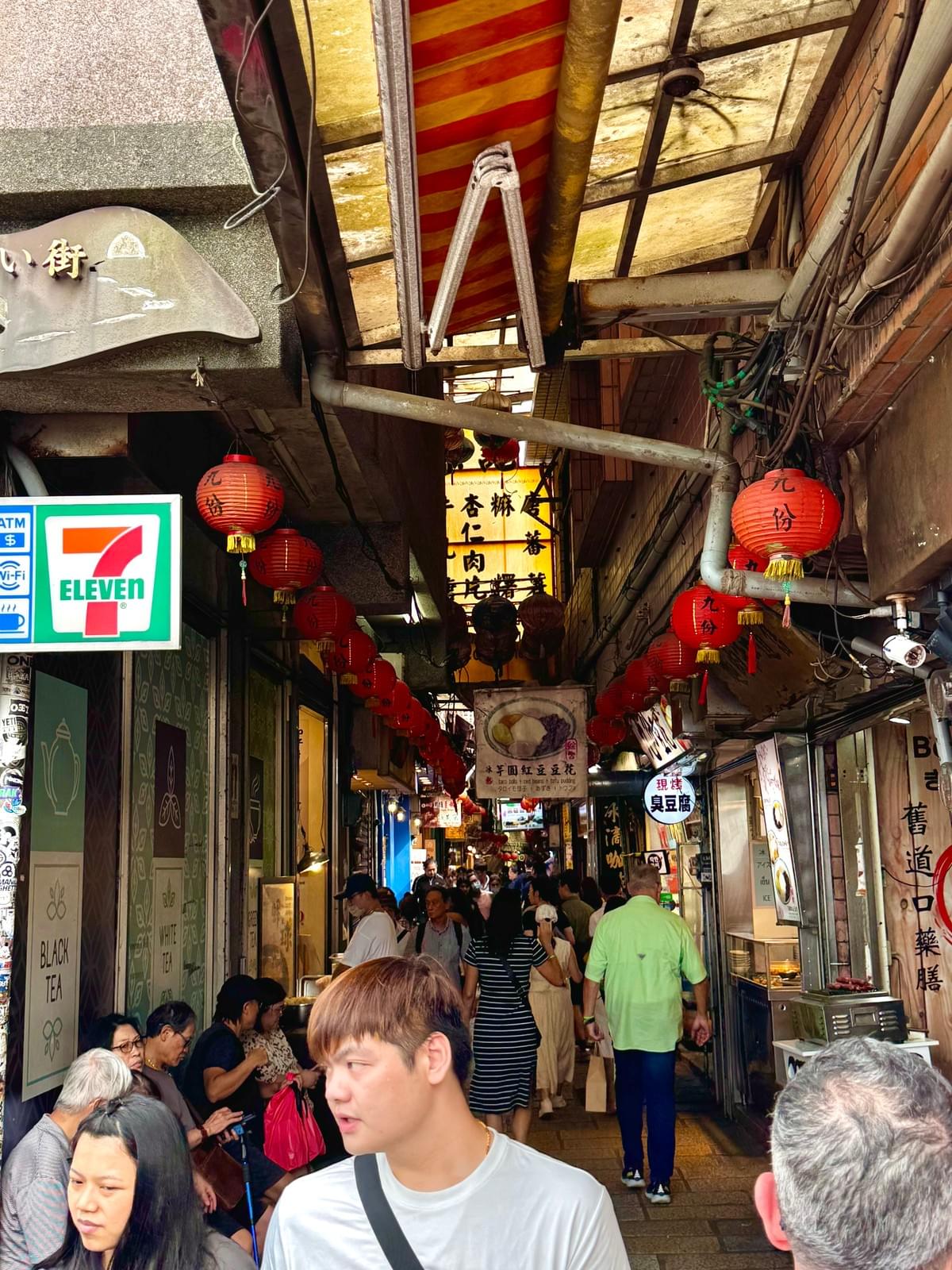 Jiufen Old Street - old and new down the stree with 711 and other shops