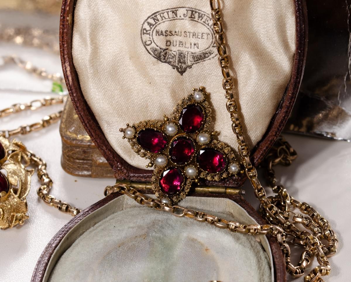 Garnet and pearl cross brooch