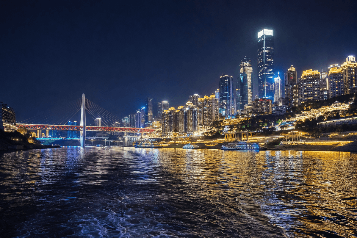 Chongqing skyline, illuminated bridges and river reflections seen during a night cruise