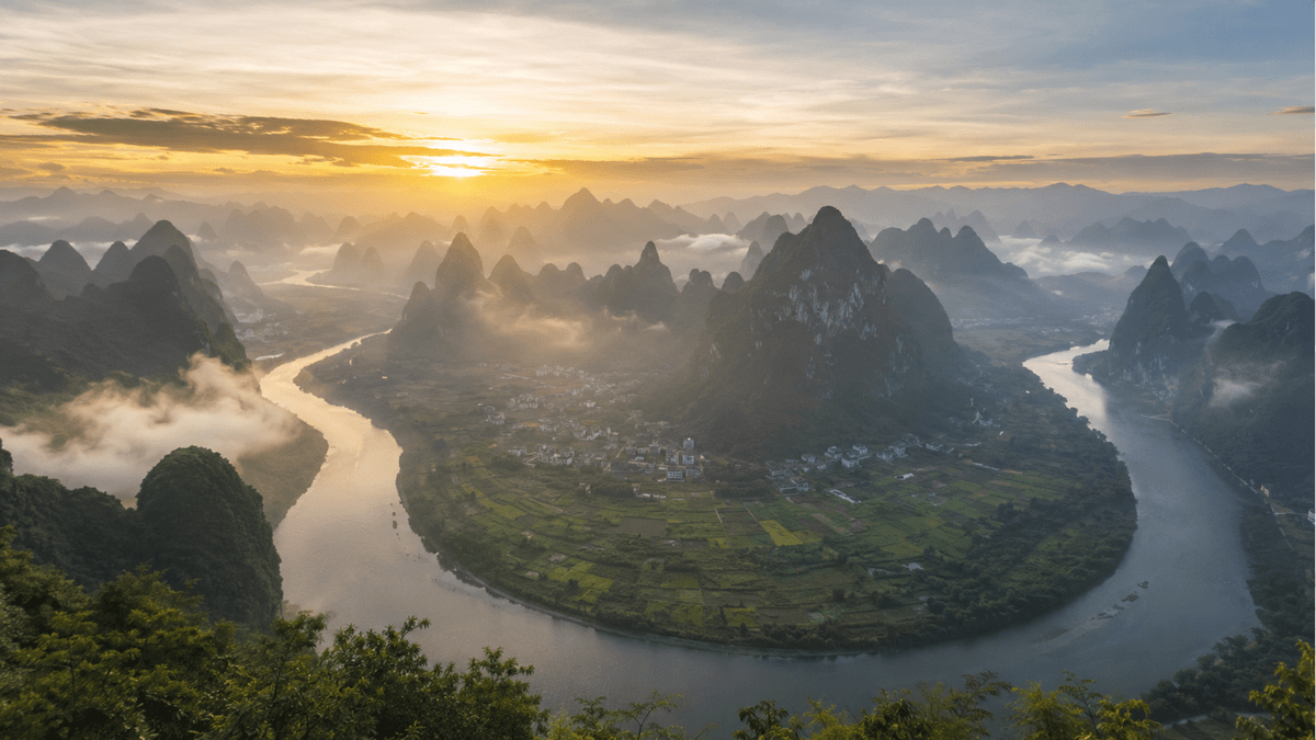 Sunrise over the Li River and karst peaks from Xianggong Mountain near Yangshuo