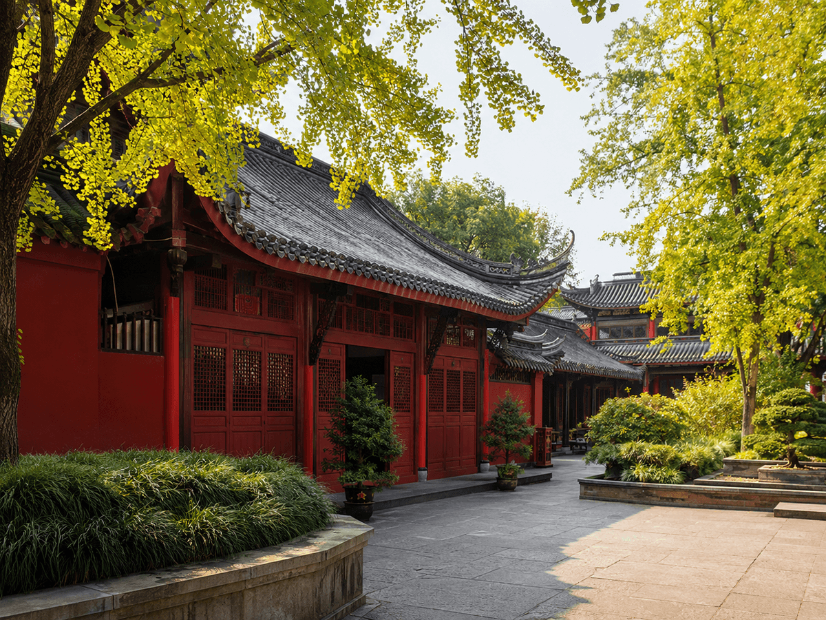 Historic red temple buildings and ginkgo trees at Wenshu Monastery in Chengdu.