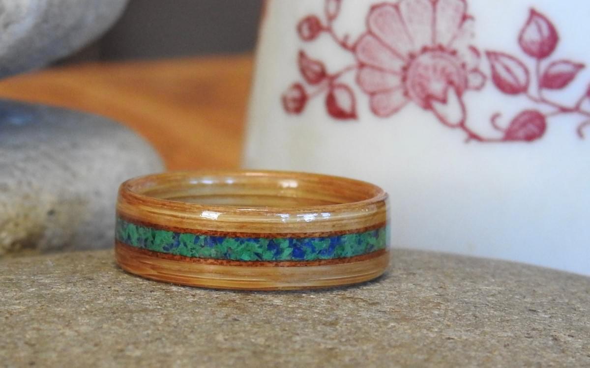 This Bamboo ring has inlays of crushed lapis and malachite bordered by narrow Koa inlays