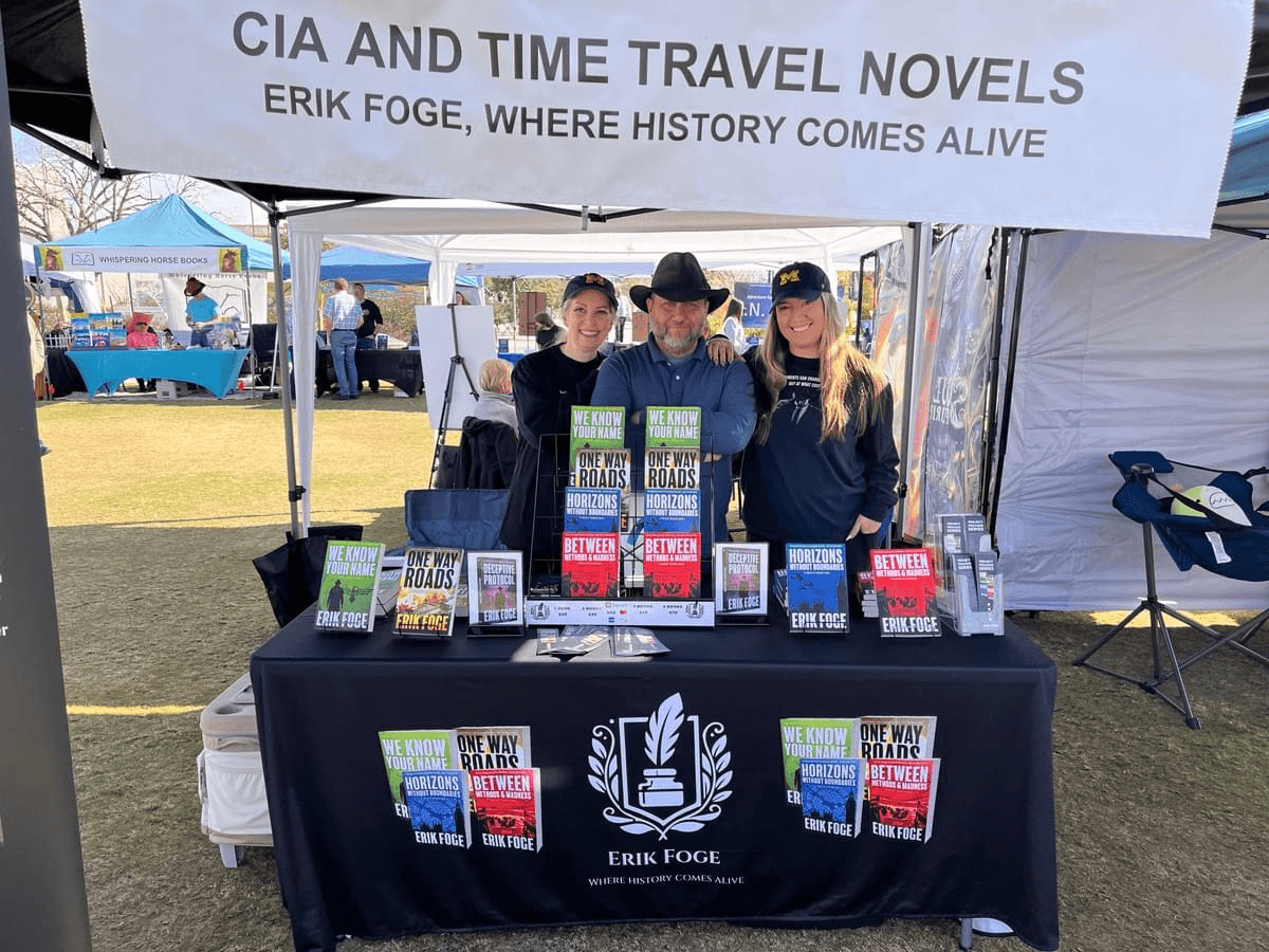 Publishers and creators showcasing books at a Marketplace booth during the Scottsdale Book Festival.
