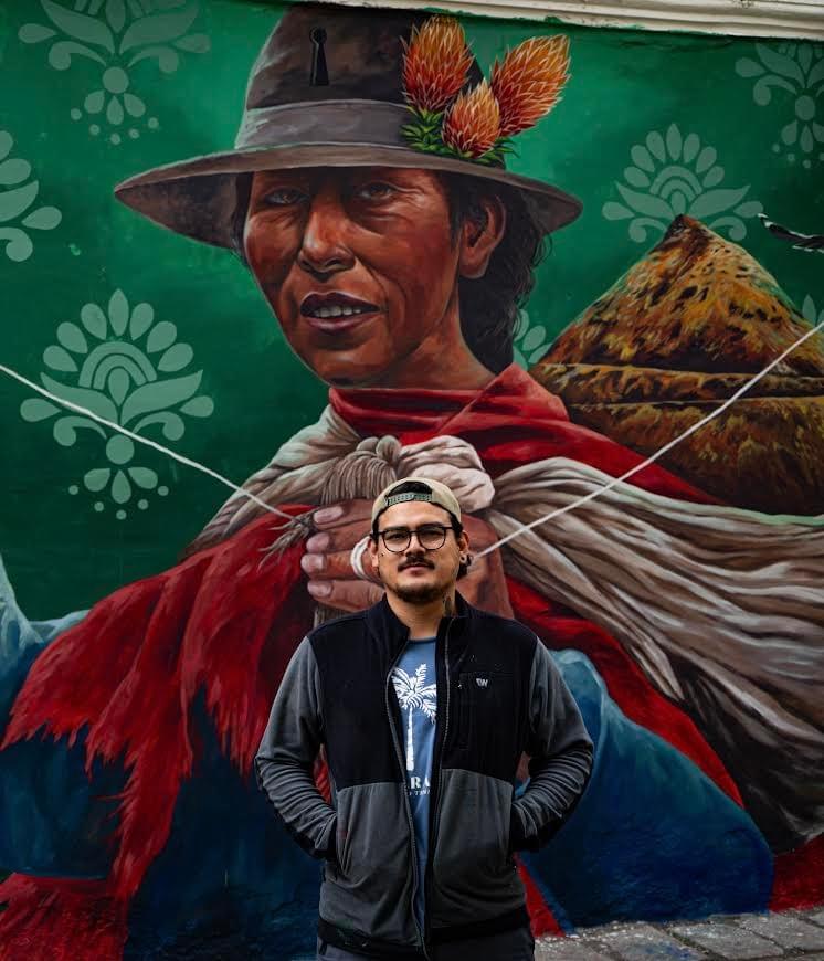 Portrait mural by Zelva Uno of an Andean woman with traditional clothing and symbolic background elements representing cultural identity in Peru
