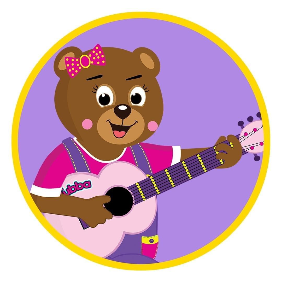 Tubba Bear smiling and playing a pink guitar in Harmony Ridge.