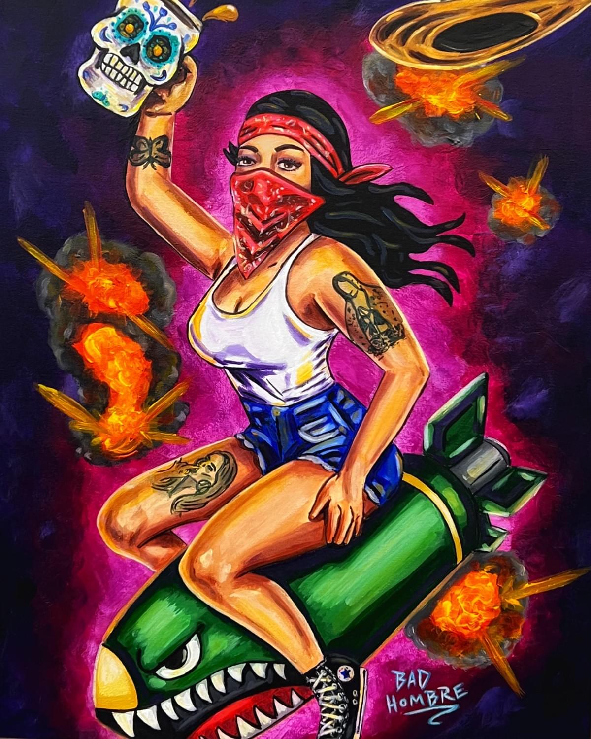 Painting by Bad Hombre of a masked woman riding a bomb while holding a calavera skull, surrounded by explosive, pop culture imagery