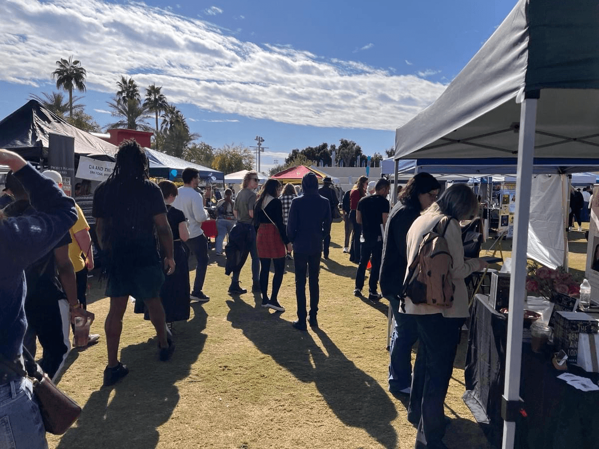 Community walks along author booths at the Scottsdale Book Festival 