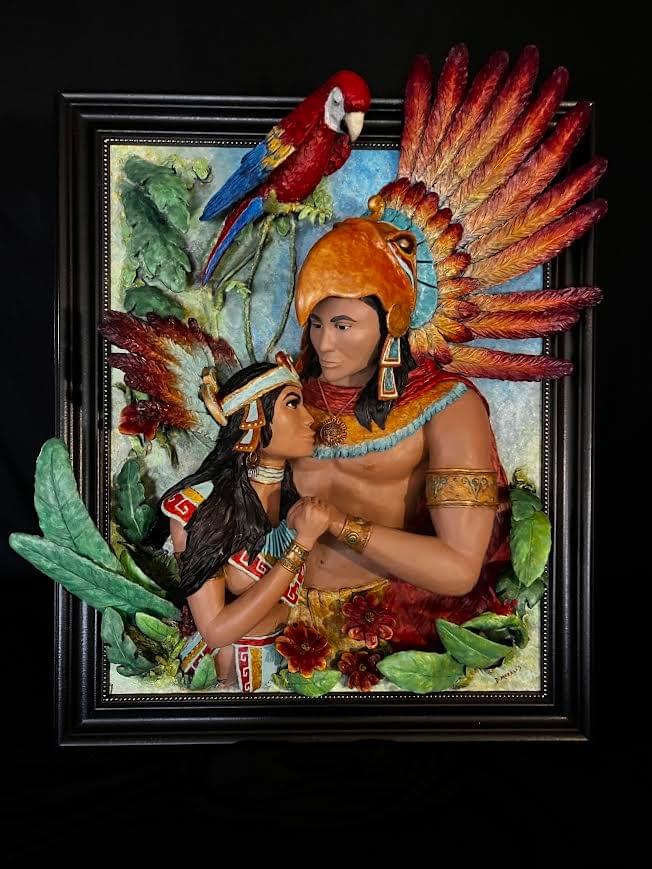 Indigenous couple with feathered headdresses and parrot in high relief sculpture by David Morales