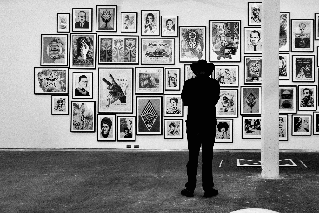 Latino artists artwork gallery wall showcasing illustration, portraits, and cultural art styles.