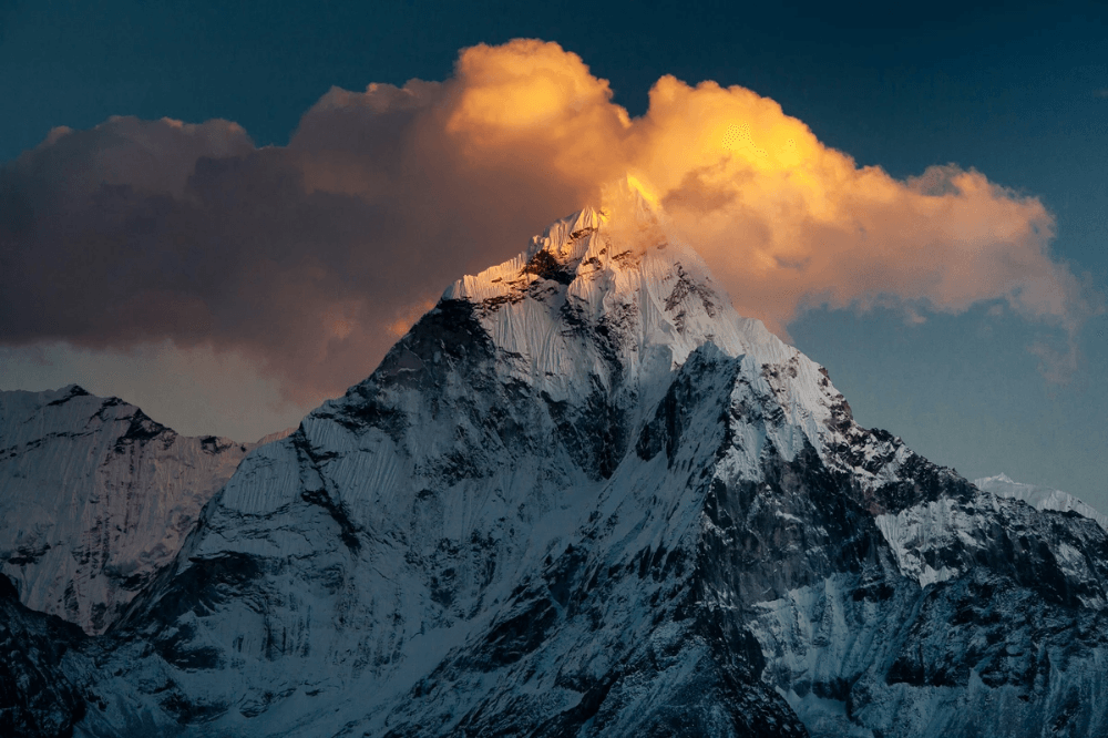 tibetan person in traditional attire amidst stunning mountain landscape