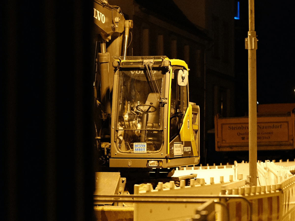 heavy equipment inspection process with workers examining machinery