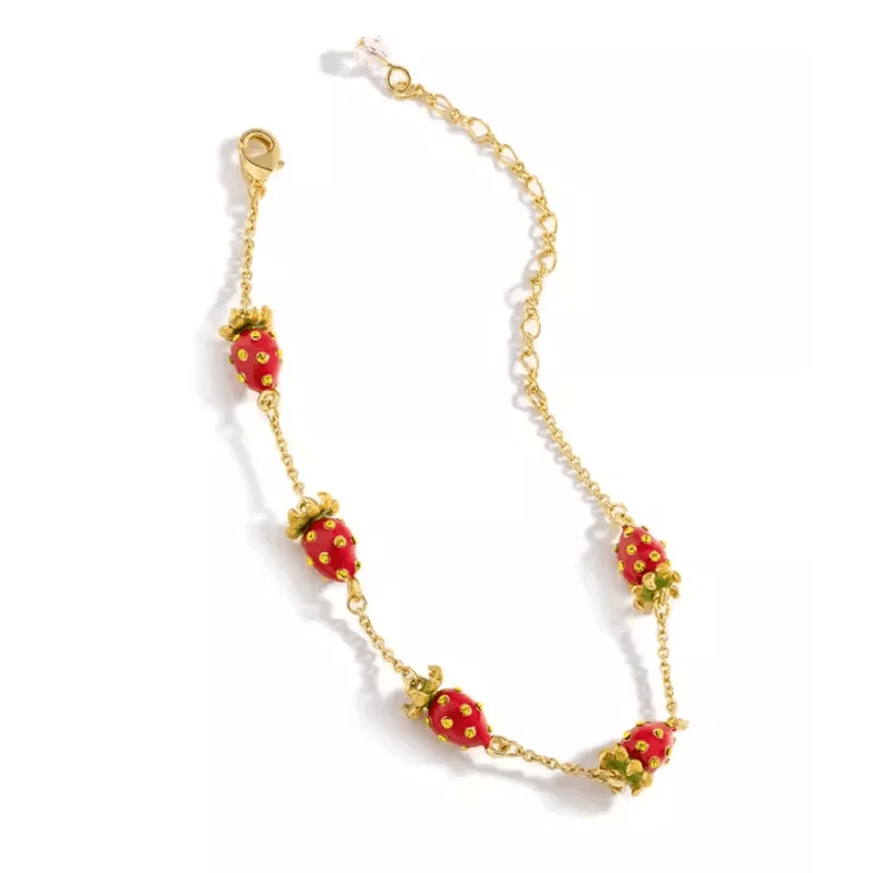 Stylish strawberry gold bracelet showcasing unique design.