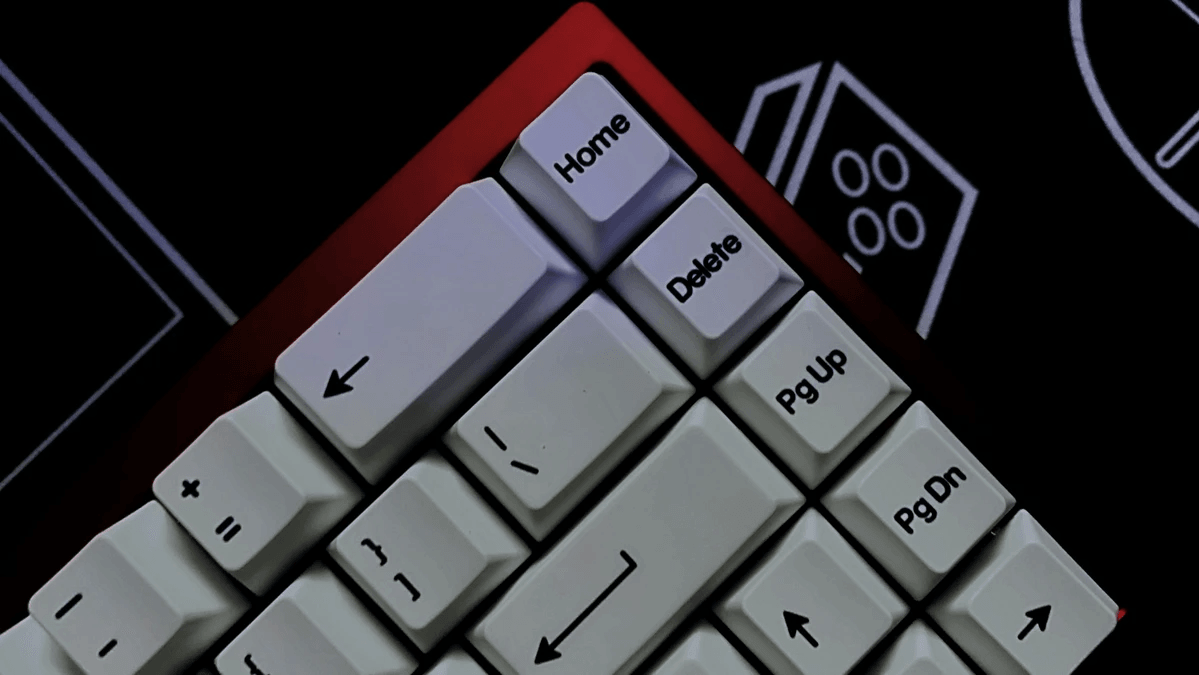 Computer keyboard beside a clock during a website page speed review