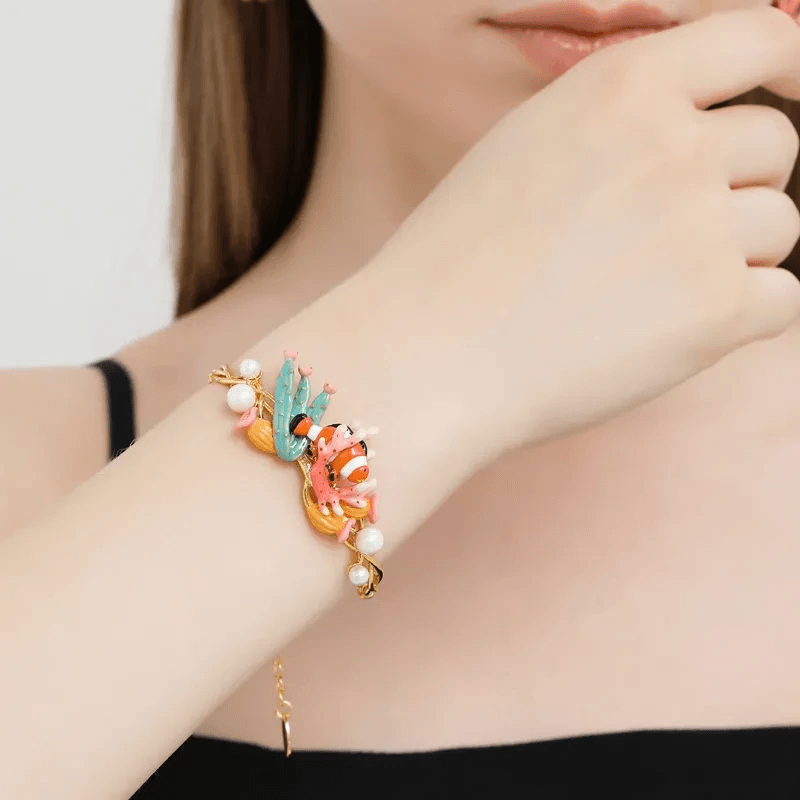 Stylish collection of fish bracelet designs including gold and silver.