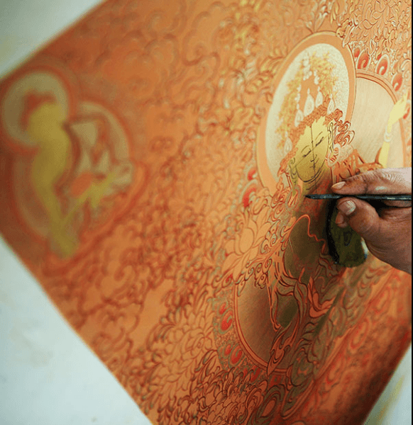 tibetan sand mandala being created by monks