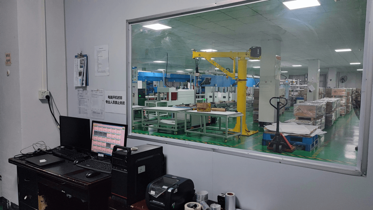 Factory control room with labeled equipment and documentation
