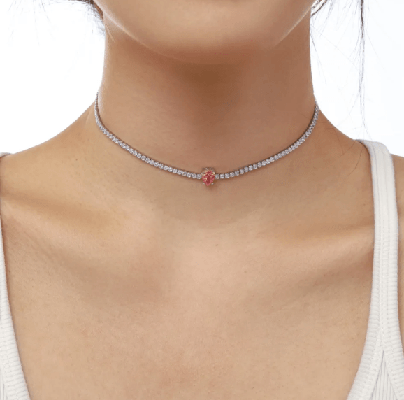Stylish woman showcasing her chic choker necklace with pendant