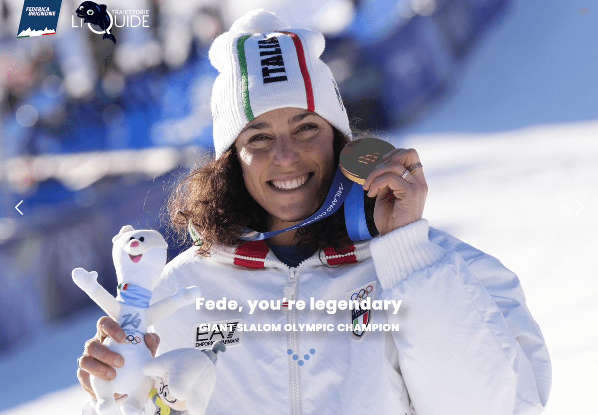 Federica Brignone smiling on snow while holding an Olympic medal beside championship text.