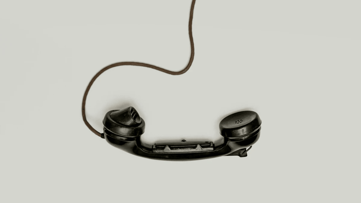 A black corded telephone representing trackable business inquiries