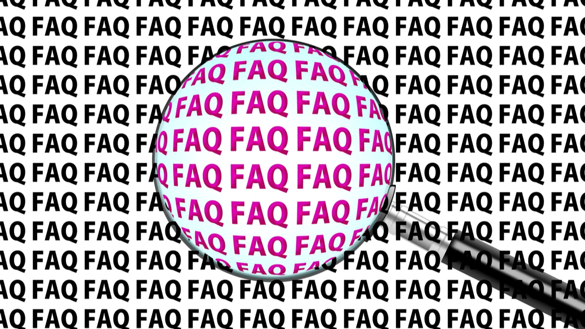 FAQ letters viewed through a magnifying glass for finding customer answers